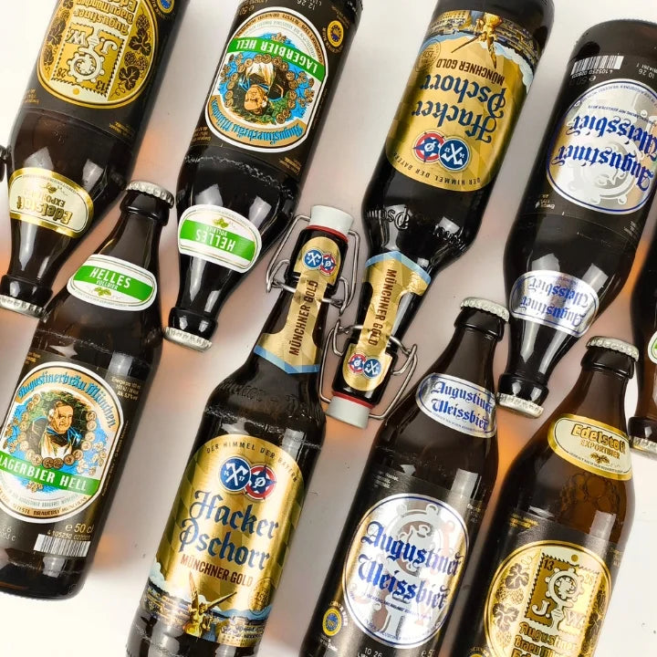 Collection of various beer bottles with different labels on a white background