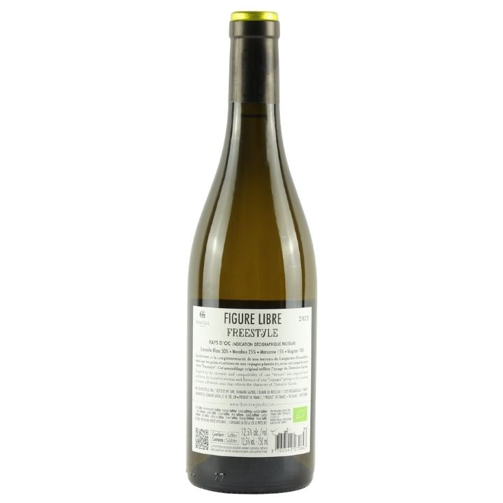 A bottle of wine shown from the back, featuring a dark green glass body, a black neck wrap with a gold cap, and a white label with black text reading 'FIGURE LIBRE FREESTYLE'.