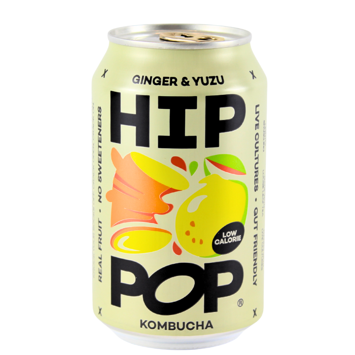 A can of Hip Pop Kombucha with Ginger & Yuzu flavor, featuring a colorful design with graphics of a lemon and a yuzu fruit.