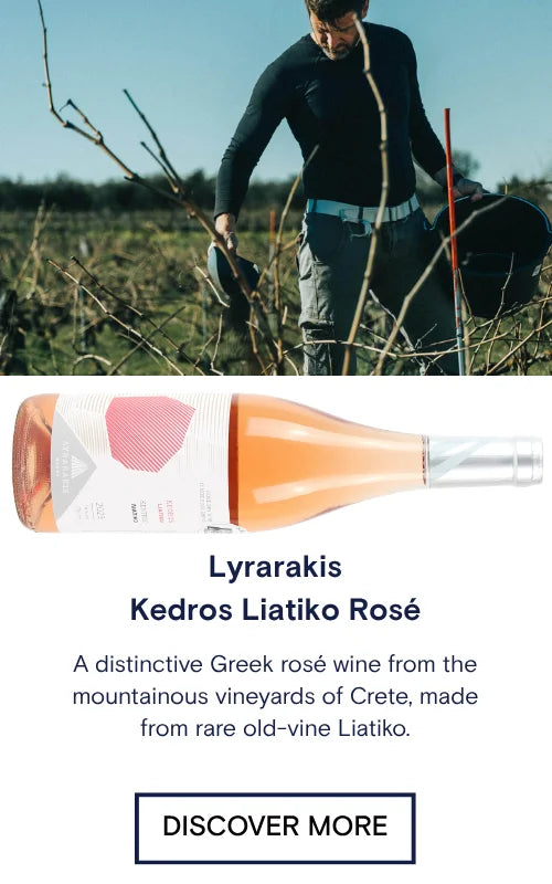 Person working in a field with Lyrarakis Kedros Liatiko Rosé wine bottle displayed below.