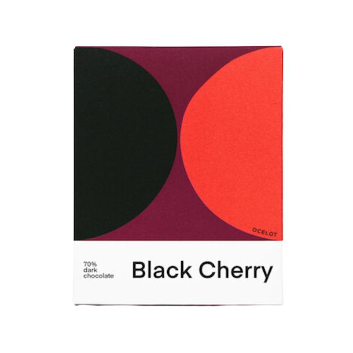 Packaging of Ocelot Chocolate Black Cherry 70g showing a geometric design in black, red, and purple with the product name and chocolate percentage indicated.