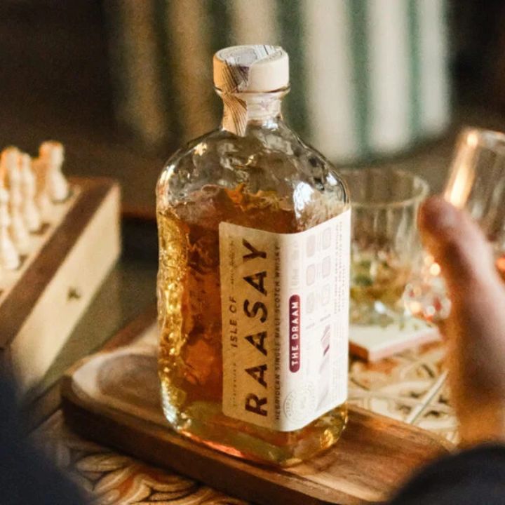 Raasay The Draam Single malt Whisky bottle by chess set and tumbler glass